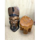 A LARGE CARVED ASIAN FACE MASK AND A CARVED WOODEN NATIVE AMERICAN STYLE STOOL