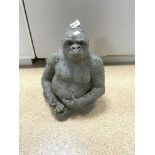 A STONE GARDEN FIGURE OF A GORILLA, 44CMS