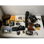 A PRAKTICA MTL 3 CAMERA, AN OPTOMAX LENS, AND OTHER CAMERAS INCLUDING A BROWNIE REFLEX