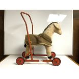 A VINTAGE CHILTERN TOYS SOFT PUSH ALONG TOY HORSE
