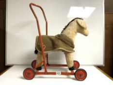 A VINTAGE CHILTERN TOYS SOFT PUSH ALONG TOY HORSE
