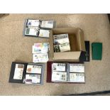 A LARGE QUANTITY OF FIRST DAY COVERS IN ALBUMS AND LOOSE