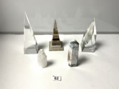 THREE STONE OBELISKS AND TWO GLASS OBELISKS