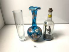 A FIGURE OF A VICTORIAN GAS LAMP CLEANER IN A BOTTLE, A TALL ETCHED GLASS VASE, 32CMS, AND A PAINTED
