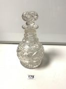 A HEAVY CUT GLASS DECANTER AND STOPPER, 26CMS