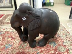 A LARGE CARVED WOODEN FIGURE OF AN ELEPHANT, 54CMS