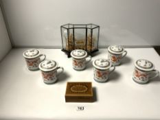SET OF SIX MODERN CHINESE CUPS WITH LIDS, A SMALL INLAID BOX, AND A CORK SCULPTOR IN A GLASS CASE