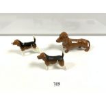 A BESWICK MODEL OF A DACHSHUND, 24CMS, AND TWO BESWICK MODELS OF BEAGLES 'WENDOVER BILLY', 15CMS