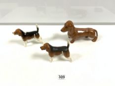 A BESWICK MODEL OF A DACHSHUND, 24CMS, AND TWO BESWICK MODELS OF BEAGLES 'WENDOVER BILLY', 15CMS