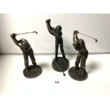 THREE BRONZE EFFECT RESIN FIGURES OF GOLFERS IN VARIOUS STAGES OF SWING, 34CMS