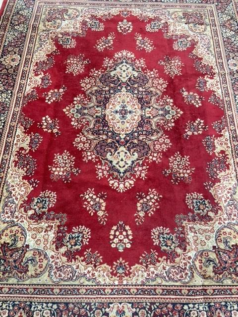 A RED GROUND BAKHARA RUG, 90 X 180CMS, AND A WOOLLEN EASTERN RUG, 98 X 160CMS