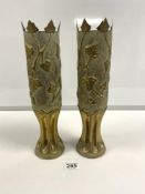 A PAIR OF BRASS TRENCH ART SHELLS WITH IVY LEAF DECORATION, 34.5CMS