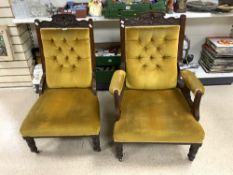 A PAIR OF LATE VICTORIAN UPHOLSTERED MAHOGANY LADIES/GENTS CHAIRS WITH CARVED DECORATION, TO BACKS