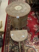 A CARVED MOORISH FOLDING TABLE AND A MILKING STOOL ON BOBBIN LEGS