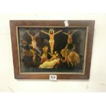 A REVERSE GLASS PICTURE OF CHRIST AND TWO DISCIPLES ON THE CROSS IN A ROSEWOOD FRAME, 34 X 23CMS