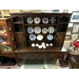 AN 18TH CENTURY DRESSER WITH PLATE RACK AND THREE DRAWERS, CROSSBANDED IN MAHOGANY ON PAD FRONT FEET