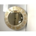 A MODERN CIRCULAR WALL MIRROR WITH OLD ENGLISH GOLD WORDS ON THE FRAME, "BEAUTY FIND THYSELF IN LOVE