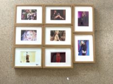 A SET OF EIGHT KYLIE MINOGUE PHOTOGRAPHS - FRAMED TWO BEARING AUTOGRAPHS