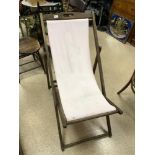 A VINTAGE FOLDING WOODEN DECK CHAIR