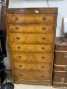 A 1930S BOW FRONTED WALNUT CHEST OF SEVEN DRAWERS, 77 X 5 X 144CMS