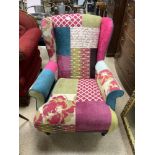 A DFS MULTICOLOURED WING BACK ARMCHAIR