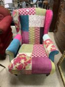A DFS MULTICOLOURED WING BACK ARMCHAIR