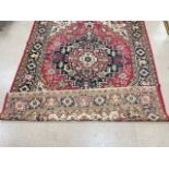 A RED GROUND PERSIAN PATTERN CARPET, 200 X 270CMS