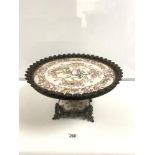 AN ORIENTAL PATTERN CERAMIC COMPORT WITH HEAVY CAST BRASS ORNATE BORDER AND FEET, 24 X 42 CMS
