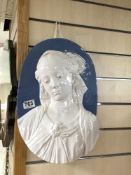 A 20TH CENTURY OVAL GLAZED POTTERY RELIEF OF A YOUNG LADY, 32 X 40CMS