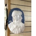 A 20TH CENTURY OVAL GLAZED POTTERY RELIEF OF A YOUNG LADY, 32 X 40CMS