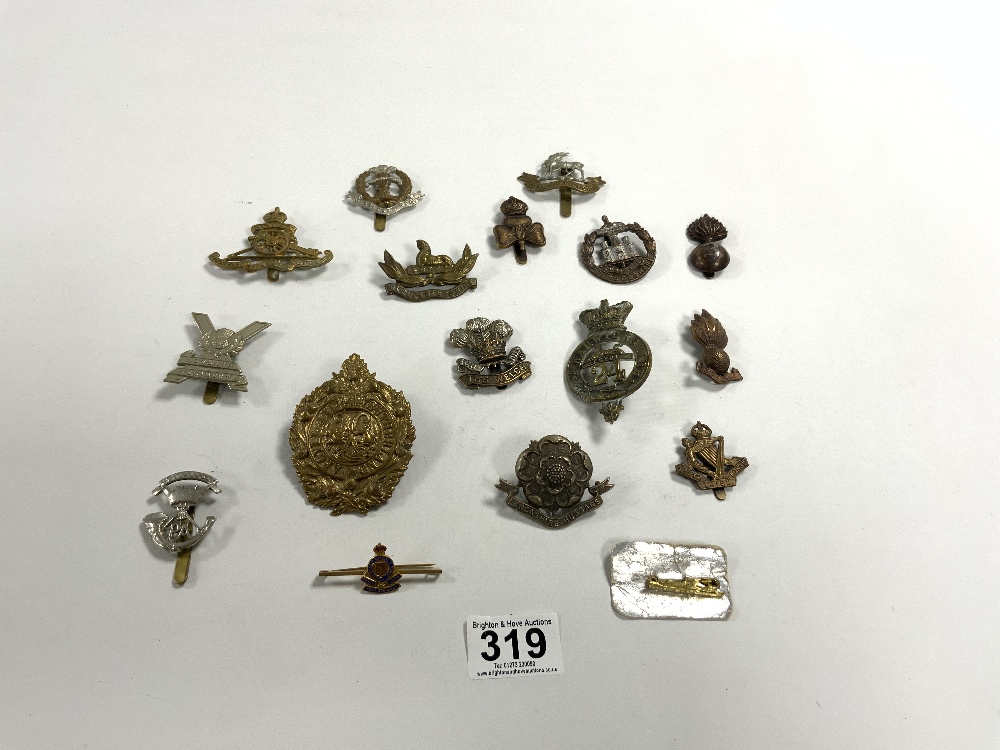 FIFTEEN MILITARY CUP BADGES AND A ROYAL CORPS BROOCH