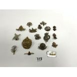 FIFTEEN MILITARY CUP BADGES AND A ROYAL CORPS BROOCH