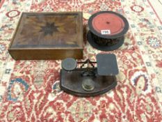 A SET OF BRASS POSTAL SCALES, LACQUERED TEA CADDY AND A PARQUETRY INLAID BOX