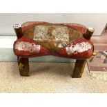 AN EGYPTIAN CAMEL STOOL WITH LEATHER CUSHION