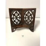 A VICTORIAN GOTHIC CARVED OAK BOOK STAND WITH CARVED FRETWORK DESIGN
