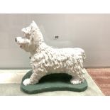 A PAINTED STONE GARDEN FIGURE OF A WEST HIGHLAND TERRIER, 38 X 40CMS