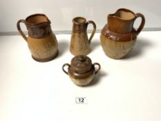 THREE ROYAL DOULTON STONEWARE HARVEST JUGS, THE LARGEST 17CMS, AND A DOULTON STONEWARE TWO HANDLE