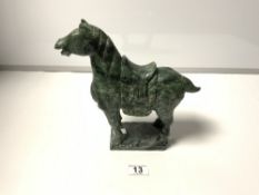 A GREEN SOAPSTONE CARVING OF A HORSE (SOME CHIPS)