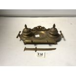 EMBOSSED BRASS DOUBLE INKSTAND AND A BRASS LETTER KNIFE.