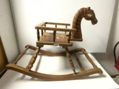 A CHILDS CARVED WOODEN ROCKING HORSE CHAIR