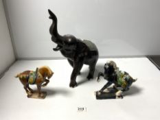 TWO CHINESE TANG STYLE CERAMIC HORSES, 16CMS AND A CARVED WOODEN ELEPHANT