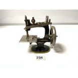 A MINIATURE SINGER SEWING MACHINE