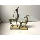 TWO SILVERED STYLIZED FIGURES OF DEER ON ALABASTER BASES, THE TALLEST 43CMS, FROM THE KINDU
