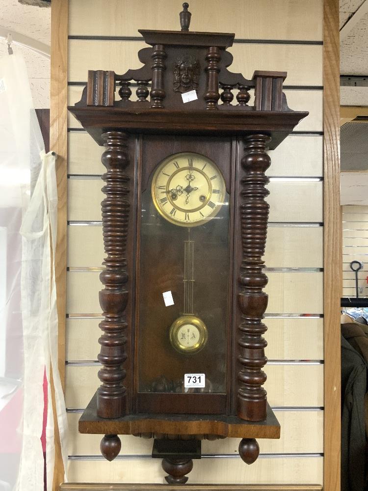 19TH CENTURY WALNUT CASED VIENNA WALL CLOCK WITH WHITE ENAMEL DIAL FLANKED BY TURNED COLUMNS, 98CMS