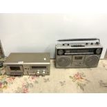 A TECHNICS M8 (RS-M8) STEREO CASSETTE DECK AND A SANYO (M9940K) PORTABLE RADIO CASSETTE PLAYER