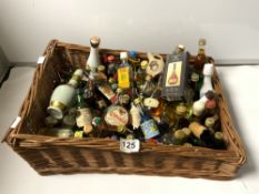 A QUANTITY OF MINIATURE BOTTLES OF SPIRITS INCLUDES, COBANA BANANA LIQUEUR, BLUE CORACAN AND MANY