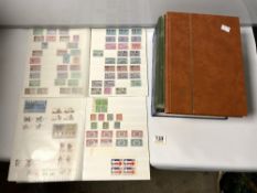 THE NEW IDEAL POSTAGE STAMP ALBUM OF WORLD STAMPS AND FOUR OTHER STAMP ALBUMS