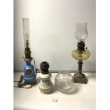 A METAL BASE AND GLASS FRONT OIL LAMP, A CERAMIC OIL LAMP, A BLUE CERAMIC OIL LAMP CONVERTED TO