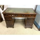 VINTAGE KNEEHOLE WRITING DESK IN MAHOGANY WITH GREEN LEATHER TOP AND NINE DRAWERS