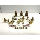 THREE ORIENTAL RED AND GOLD DECORATED WOODEN FIGURES, AND PLASTIC MODELS OF FIGURES PULLING